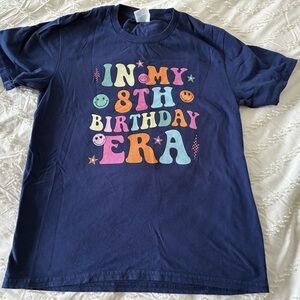 Birthday era blue tee shirt.    100% cotton